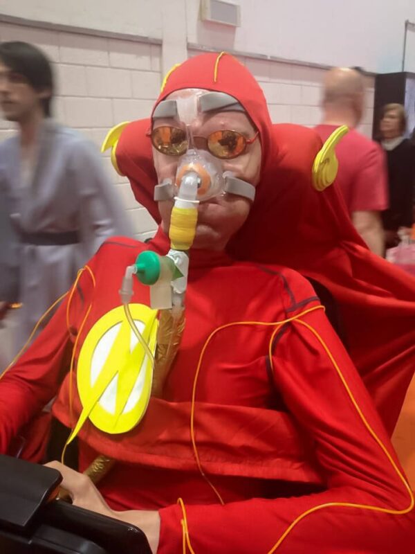 A picture of me in my wheelchair dressed as The Flash