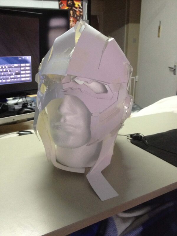 A cardboard Flash helmet on a polystyrene head
