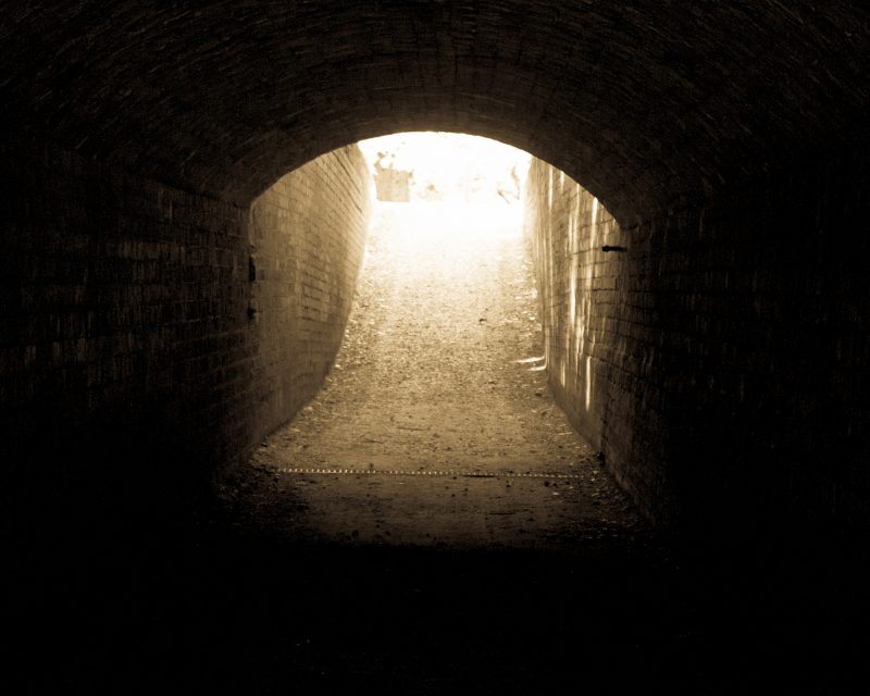 Light at the end of the tunnel - Copyright 2016 Daniel Baker - a sepia brick tunnel with light at the end, taken at Hanbury Hall