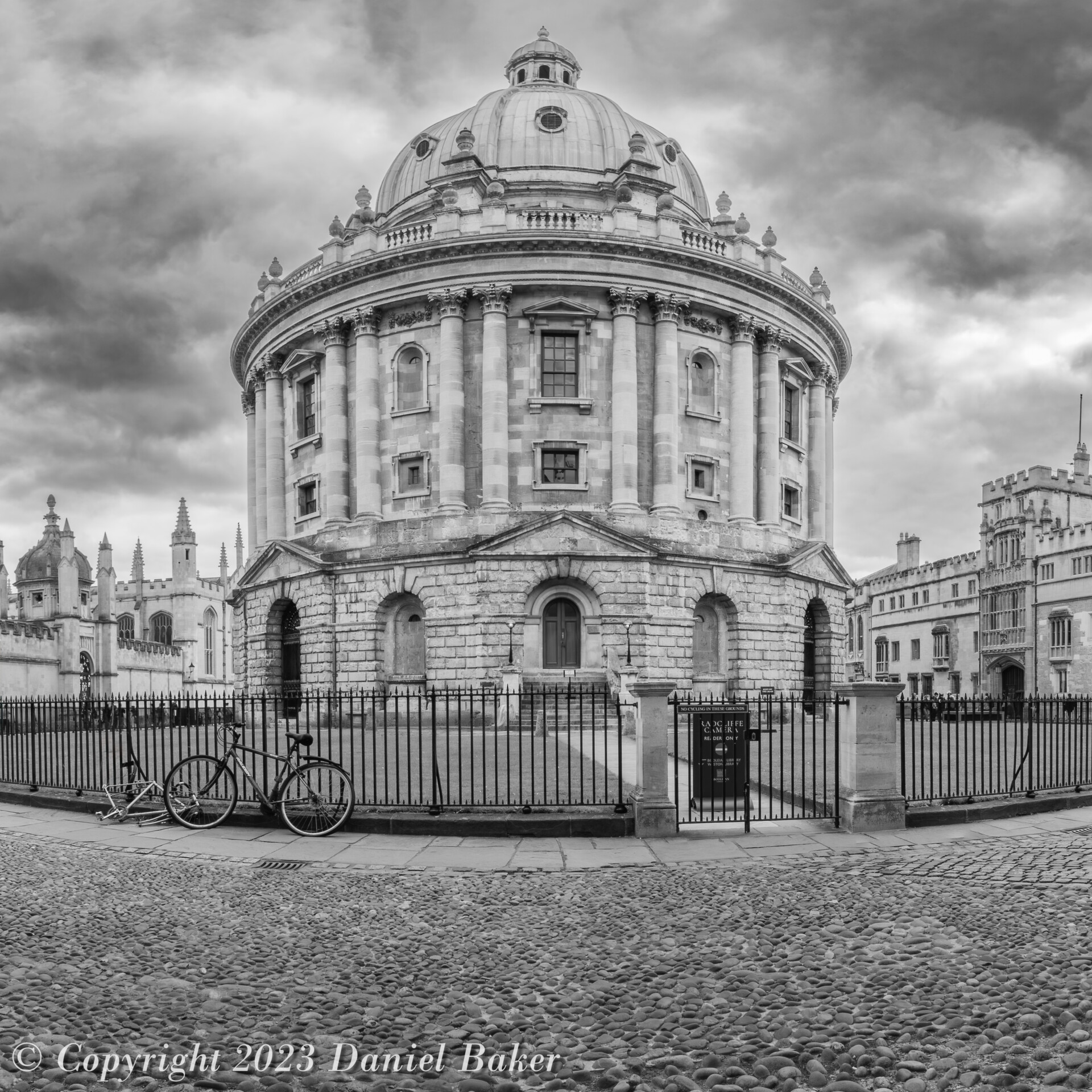 A black and white photograph of the Radcliffe camera in Oxford, an old round library building